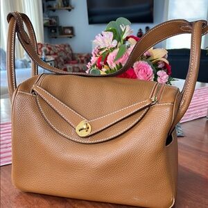 Tan Leather Shoulder Bag with Curved Flap and Gold Accent